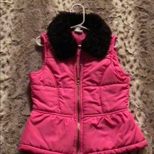 A hot pink vest with black fur at the top!!✨